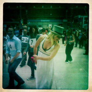 Teaching 'the Madison' steps to local volunteers as trains arrive and depart.